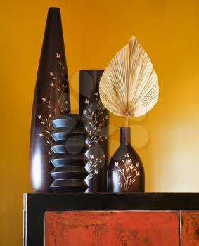 Royalty Free Photo of a Still Life of Interior With Asian Vases on a Dresser