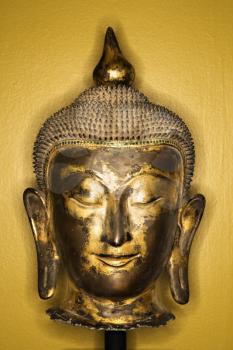 Royalty Free Photo of a Bronze Buddha Head from Thailand