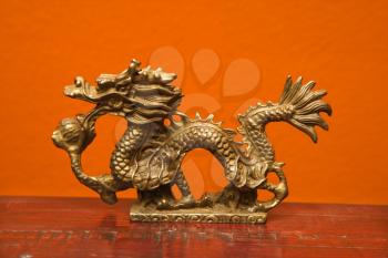 Royalty Free Photo of a Chinese Taoist Wisdom Brass Dragon Statue