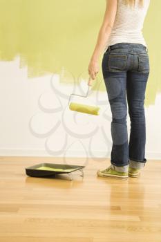 Royalty Free Photo of a Woman Holding a Paint Roller