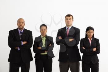 Royalty Free Photo of a Businesspeople Standing With Arms Crossed Looking Serious