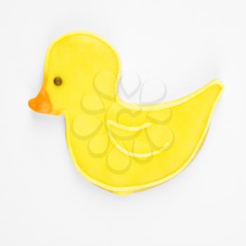 Sugar cookie in shape of duck with decorative icing.