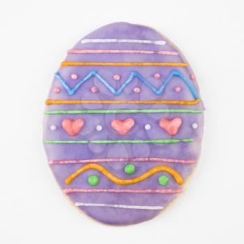 Royalty Free Photo of a Sugar Cookie in the Shape of an Easter Egg With Decorative Icing