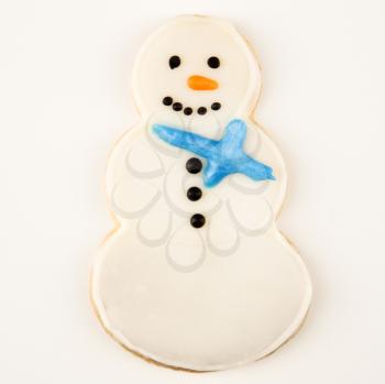 Snowman sugar cookie with decorative icing.