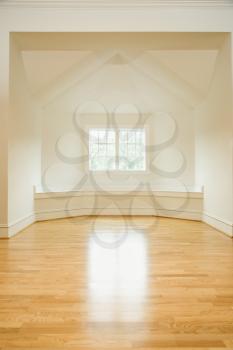 Royalty Free Photo of an Empty Room in a House With Hardwood Floors