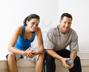 Royalty Free Photo of a Woman and Man Sitting Together