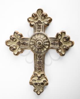 Ornamental religious cross against white background.