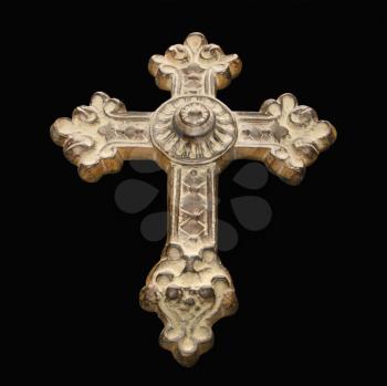 Royalty Free Photo of an Ornamental Religious Cross Against a Black Background