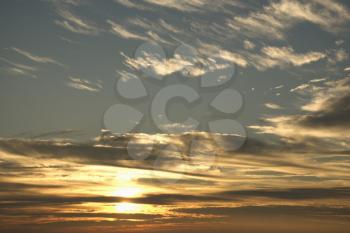 Royalty Free Photo of the Sun in the Blue Sky With Clouds
