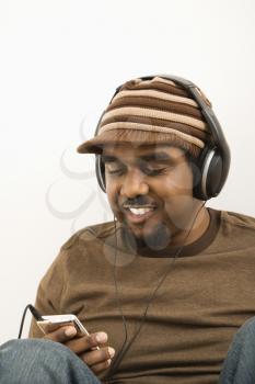 Royalty Free Photo of a Man  Listening to an Mp3 Player  Smiling