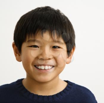 Royalty Free Photo of a Portrait of a Young Boy Smiling