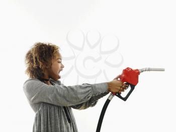 Royalty Free Photo of a Woman Holding Out a Gas Pump and Shouting