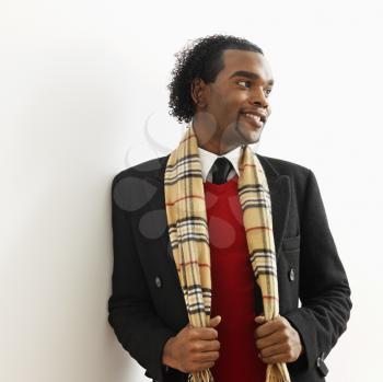 Royalty Free Photo of a Portrait of a Man in Dress Attire and Scarf
