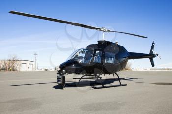 Royalty Free Photo of a Helicopter With a Camera Mounted on Front 