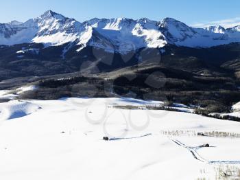 Royalty Free Photo of an Aerial Landscape of Colorado Rockies With Snow Covered Valley in 
Foreground