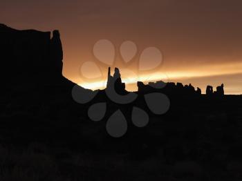 Royalty Free Photo of a Sunset Landscape of Mesas in Monument Valley 