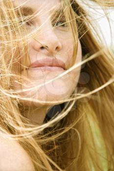 Royalty Free Photo of a Close-up Portrait of a Redheaded Woman With Windblown Hair