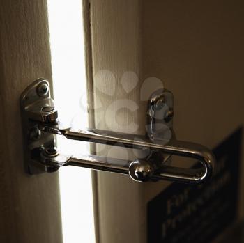 Royalty Free Photo of a Close-up of a Security Lock on a Hotel Room Door