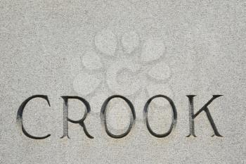 Royalty Free Photo of a Gravestone With the Word 'Crook' On It