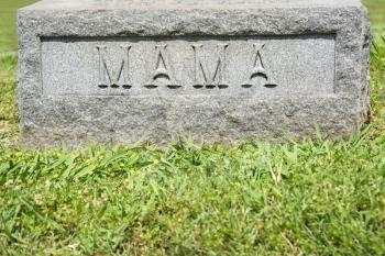 Royalty Free Photo of a Gravestone Marker With the Word 'Mama' on it
