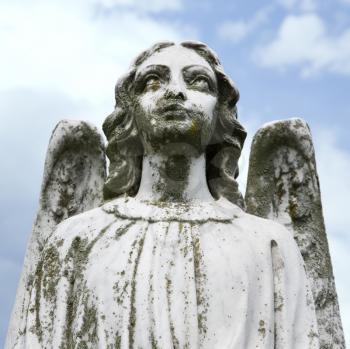 Royalty Free Photo of a Guardian Angel Statue in a Graveyard