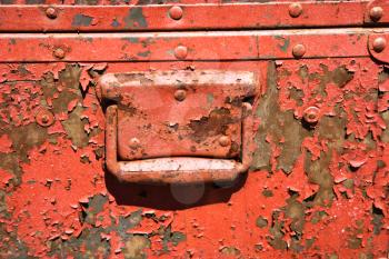 Royalty Free Photo of an Old Orange Weathered Metal Storage Container
