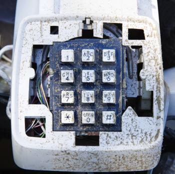 Royalty Free Photo of a Close-up of an Old Dirty Telephone