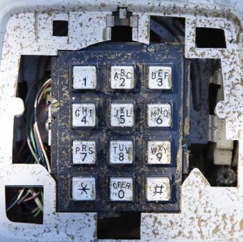 Royalty Free Photo of a Closeup of an Old Dirty Telephone Keypad