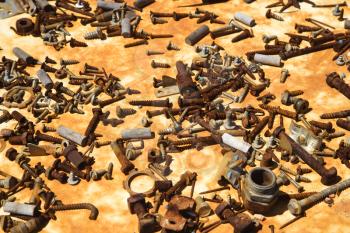 Multiple old rusty nails and screws.