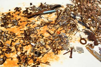 Royalty Free Photo of Old Rusty Nails and Screws on a Table