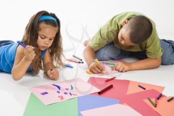 Royalty Free Photo of a Boy and Girl Coloring Together