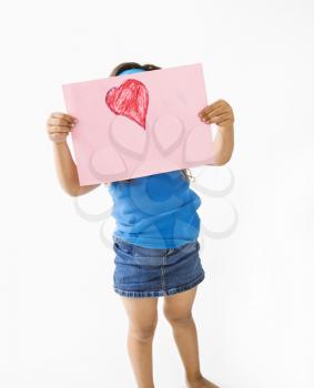 Royalty Free Photo of a Young Girl Showing off Drawing of a Heart