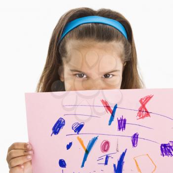 Royalty Free Photo of a Young Girl Holding a Drawing