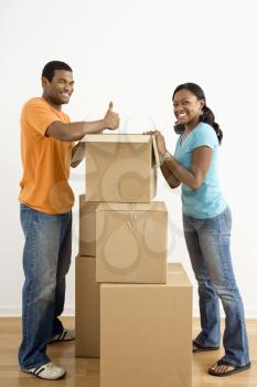 Royalty Free Photo of a Couple Packing Cardboard Boxes