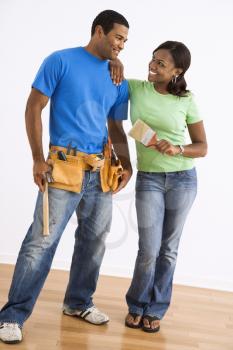 Royalty Free Photo of a Smiling Couple With Home Repair Tools