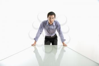 Royalty Free Photo of a Businessman Standing Over a Conference Table