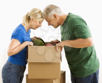 Royalty Free Photo of a Couple Looking Through a Box