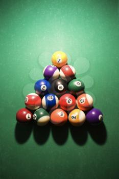 Overhead view of racked pool balls on pool table. Vertical shot.