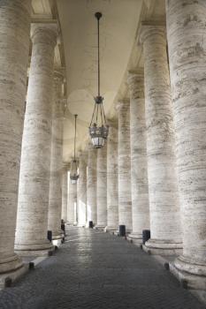 Columned hallway in Saint Peter's Square. Vertical shot.