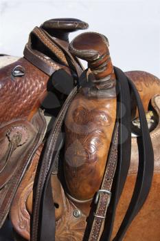 Closeup of two western horse saddles grouped together. Vertical shot.