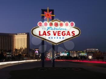 Lighted sign reading Welcome to Fabulous Las Vegas Nevada at dusk. Horizontally framed shot.