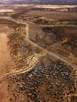Aerial view of a of rural, desert landscape with roads running through it. Vertical shot.