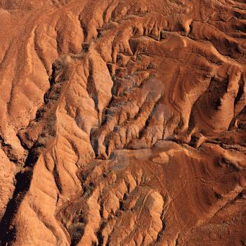 Aerial view of an arid, craggy landscape. Square shot.