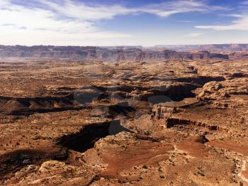 Aerial view of an arid, craggy landscape. Horizontal shot.