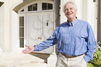 Royalty Free Photo of a Senior Man Outside His Home