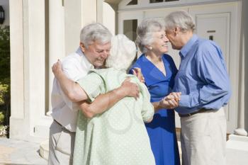 Royalty Free Photo of Seniors Greeting Each Other