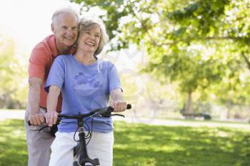 Royalty Free Photo of a Senior Couple on a Bicycle