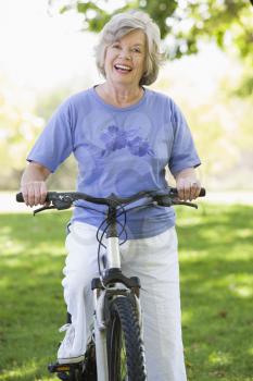 Royalty Free Photo of a Senior Woman on a Bike