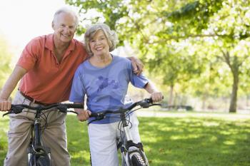 Royalty Free Photo of a Senior Couple Riding Bikes