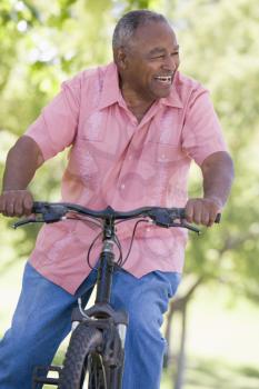 Royalty Free Photo of a Senior Man on a Bicycle